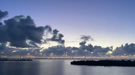 Watch as Miami vanishes from view at sunrise behind a bank of rare coastal fog rolling in from the Atlantic