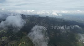 Drone Footage Of Miao Village, China Shrouded By Clouds