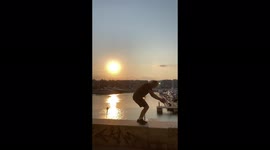 17 Year Old Guy Does Backflip At The Ledge Of A High Roof