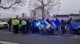 Piers Corbyn speaks to police officers during protests supporting Canada's 'Freedom Convoy'