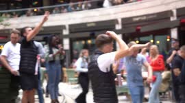 Flares, chanting and dancing amongst England fans in Leicester Square London