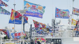 Flags flutter in Okinawan port as Japanese fishers mark Lunar New Year