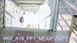 Woman narrowly escapes coming under approaching train in western India