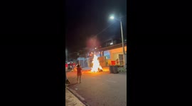 Ghostly figure rises from fire during Lunar New Year celebration in Malaysia