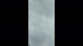 Protesters launch balloons into the air during a protest on working conditions and low pay in Istanbul, Turkey
