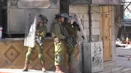 Demonstrators throw stones at Israeli troops in protest over killing of three Palestinians by Israeli forces