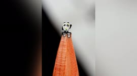 Chinese man sculpts tiny Winter Olympic mascots into pencil leads