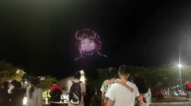 Hundreds of drones form US-born Olympian Eileen Gu's portrait to celebrate gold medal win