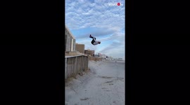 Hilarity as brave backflip fails end with faces full of sand