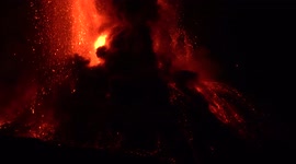 Mount Etna erupts spectacularly spewing lava into Sicilian night sky