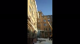 Watch moment HUGE icicle falls and destroys entrance of Russian building