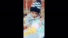 A younger brother kissing his elder brother