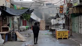 Palestinian protesters hurl stones toward Israeli troops during clashes