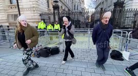 Dancing Boris Johnsons protest outside Downing Street