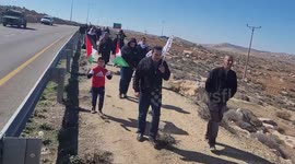 Palestinian protesters take part in a demonstration against settlements in Masafer Yatta, south of Hebron, in the southern West Bank.