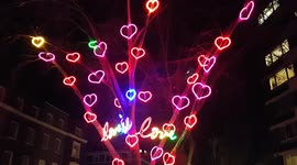 Cute Valentines Day themed tree with neon lovehearts in London