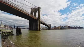 Brooklyn bridge with sky and clouds in motion time lapse in nice sunny day