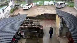 Car bursts into flames after children throw lit fireworks at it in China