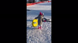 Kid finds out the hard way why she shouldn't approach a speeding sledge