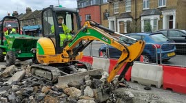 Workmen at work repair road