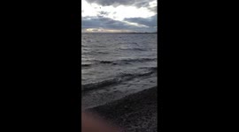 Airplane flying over the ocean in chilly extreme weather conditions
