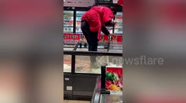 Supermarket employee seen stepping on food inside freezer in eastern China