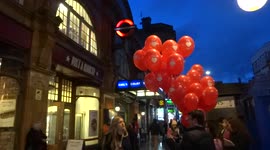 Valentines Day balloons giveaway by TLC at Earls Court station - London