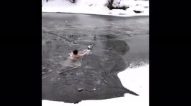 Russian woman rescues husky after it fell through ice on frozen river