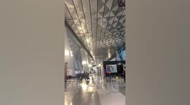 Airport roof collapses in front of terrified passengers during rain storm in Indonesia