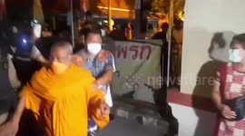 Buddhist monk caught by furious followers with a half-naked woman