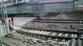 Lucky rider just inches from death as bike destroyed by passing train in northern India
