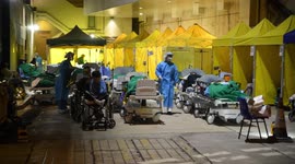 Patients forced to stay outside overnight as Hong Kong hospital buckles under COVID-19 spike