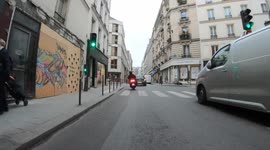 Motorcyclist is going fast on a narrow pavement to overtake a moving car and brushes against a pedestian