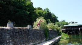 his 79-year-old grandfather jumps as a competitor into the Una River in the town of Bosanska Otoka