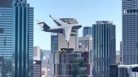 Crazy moment massive military cargo jet flies through middle of Australian city