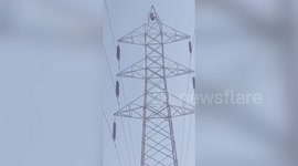 Man climbs high tension power supply line tower after being upset with family in central India