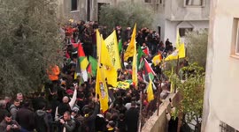 Palestinian mourners attend the funeral of Nehad Bargouthi, 19, in the village of Kafr Ayn