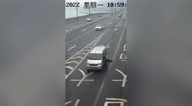 Chinese police officer dragged along road by minibus as motorist attempts to avoid being stopped