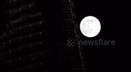 Stunning 'snow' full moon moves past The Shard in London