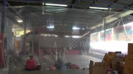 Thai slum residents with Covid-19 isolate in makeshift quarantine facility