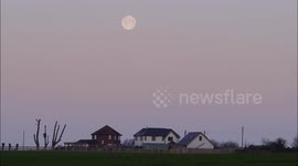 Full 'Snow Moon' seen setting over properties in Kent, UK