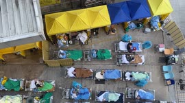 Medical workers treat patients outside as Hong Kong hit with spike in COVID-19 cases