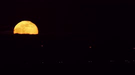 Orange 'Snow Moon' seen rising in Kent, UK