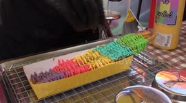 Thai food stall sells 12-inch long rainbow cheese-covered French fries