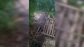 Swelling river destroys bamboo bridge as flooding hits Indonesia