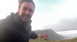 Storm chaser braves winds of over 80 mph upon Cornwall cliffs as Storm Eunice strikes
