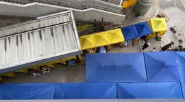 Medical workers treat patients outside as Hong Kong hit with spike in COVID-19 cases