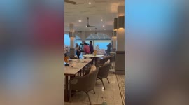Thunderstorm batters hotel buffet with wind and rain in Thailand
