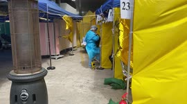 Rows of tents set up outside as COVID-19 spike forces hospital to treat patients outdoors