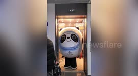 Funny moment huge Winter Olympics mascot gets stuck coming out of elevator in China